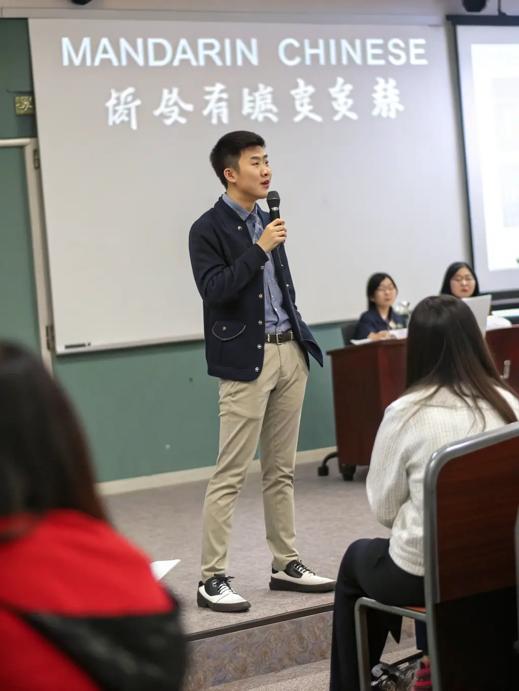 A student confidently presenting a Mandarin presentation, demonstrating advanced language proficiency and cultural understanding, illustrating the advanced level.